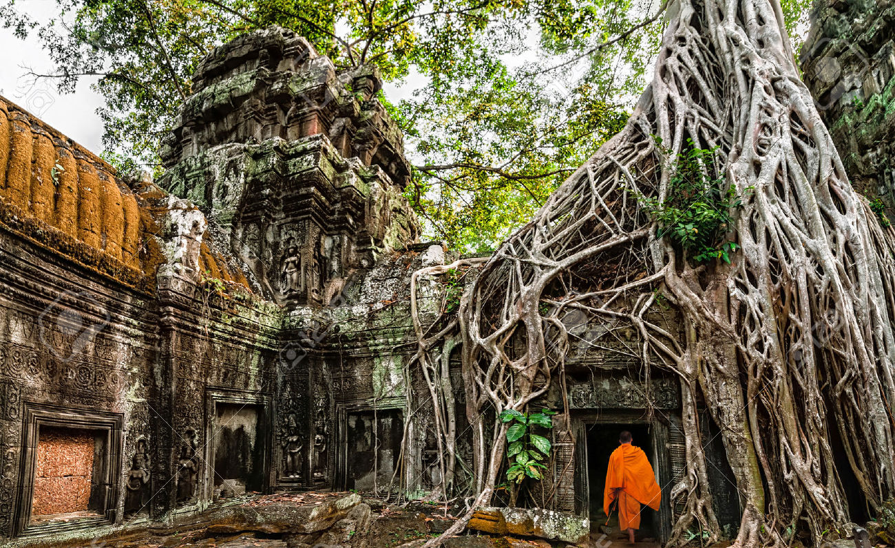 29657363-Buddhist-monk-at-Angkor-Wat-Ancient-Khmer-architecture-Ta-Prohm-temple-ruins-hidden-in-jungles-Popul-Stock-Photo